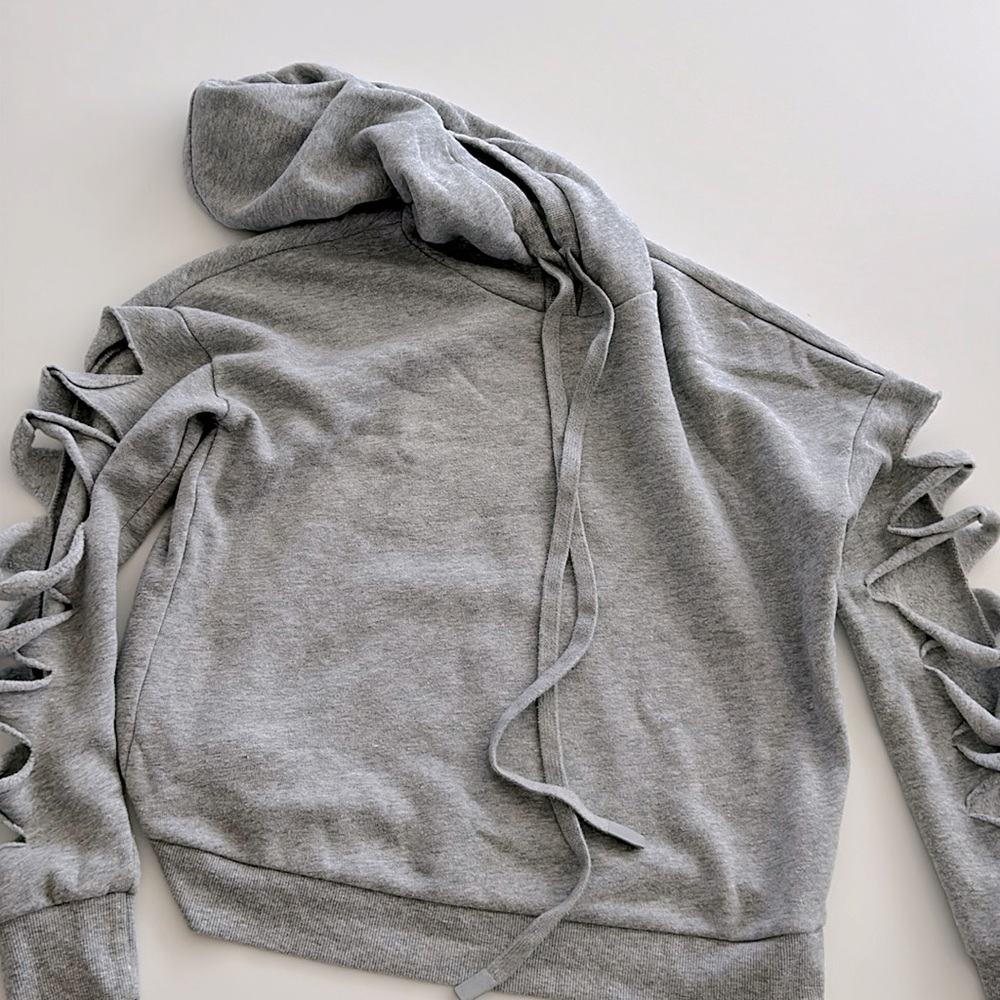gray sweatshirt. sleeves ripped makes it memorable. so soft.